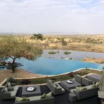 View over dining patio, outdoor pool to pond, field