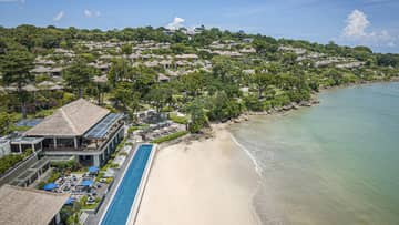 Aerial shot of the Resort, visible shoreline and foliage