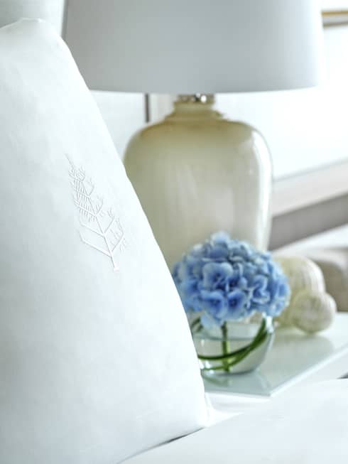 Four Seasons bed, nightstand with lamp, and two-seat sofa