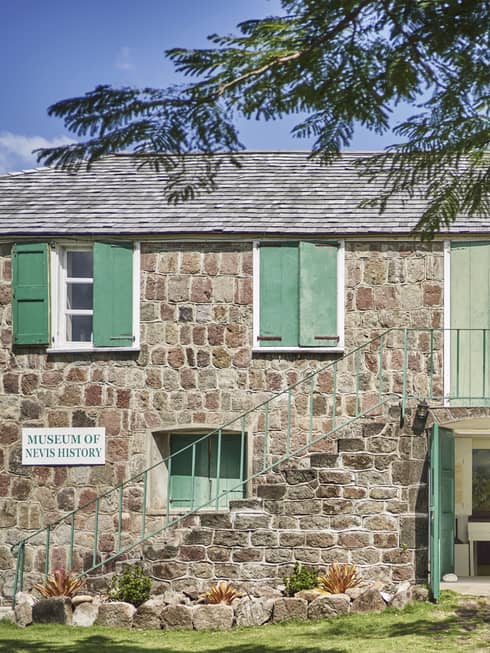 Hamilton House (museum building at Alexander Hamilton's birthplace on Nevis): gray stone building with green shutters