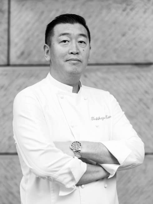Regional Japanese Chef Toshikazu Kato in white chef?s coat, standing with arms folded