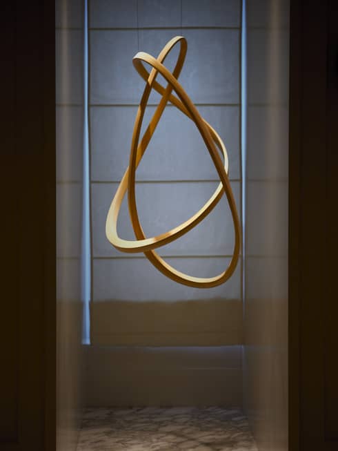 Suspended curved ash wood sculpture 