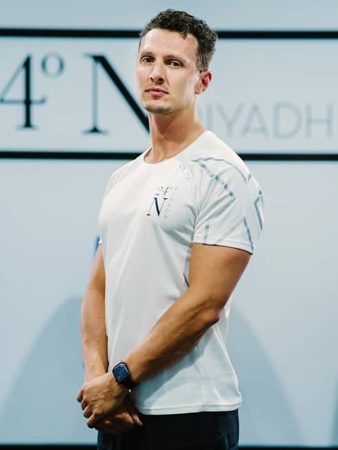 A front-facing shot of Mason Tustin in a white company shirt.