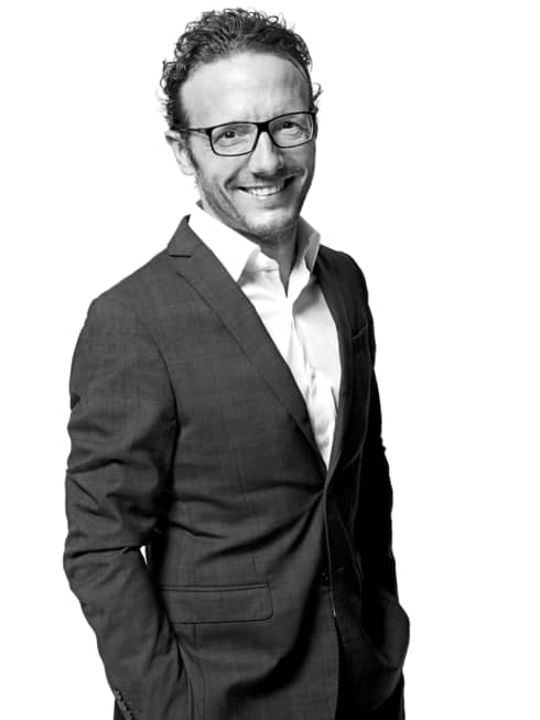 Black-and-white portrait photo of Chef Simone Zanoni