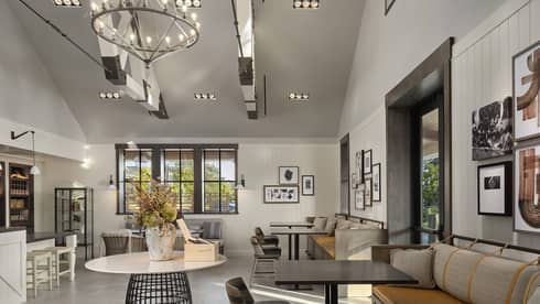 A large room with many seats and an eclectic style.