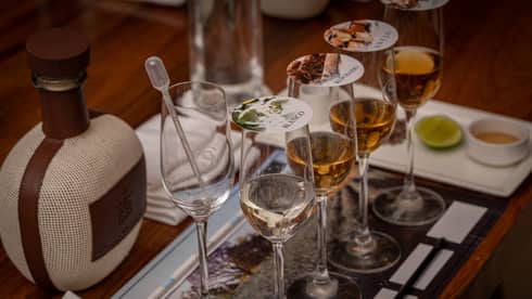 Blending tequila in glasses with covers.