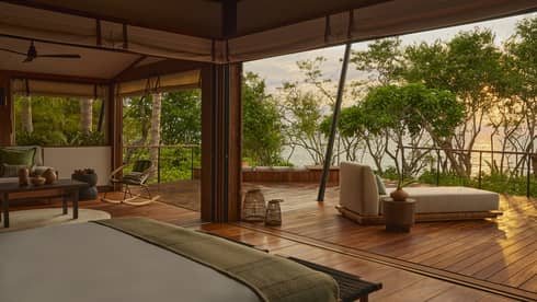 Luxury tent in tropical forest with ocean view