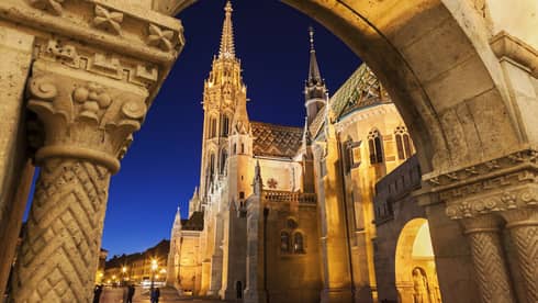 Exterior of historic buildings in Budapest at dusk
