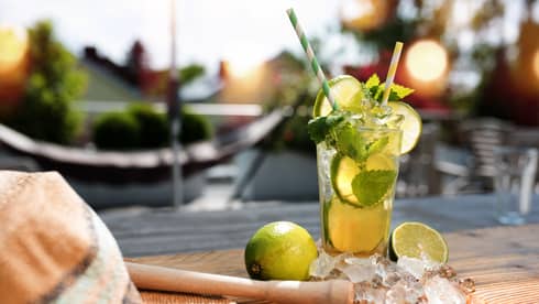 Fresh Mojito cocktail in summer on a terrace