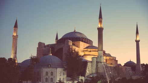 Looking up at the Sultan Ahmed Mosque in Istanbul at sunset