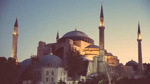 Looking up at the Sultan Ahmed Mosque in Istanbul at sunset