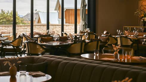 Dining room at TRUSS Restaurant + Bar with large, rectangular windows.