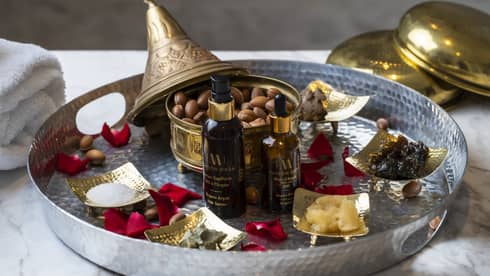 Tray filled with massage oils for hammam treatment