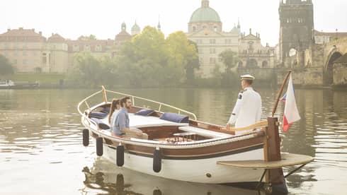 Couple enjoying river boat trip in Prague