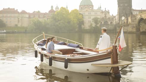 Couple enjoying river boat trip in Prague