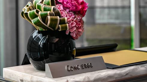 Concierge desk at luxury hotel and flower bouquet