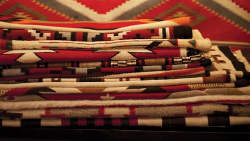 Stack of colourful folded fabrics