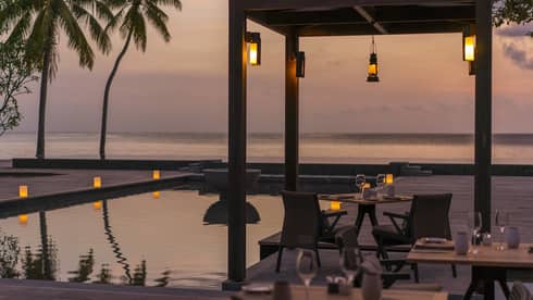 Claudine restaurant water views and exterior illuminated at night