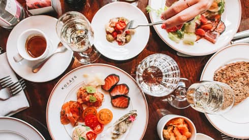 Table full of brunch dishes and glassware
