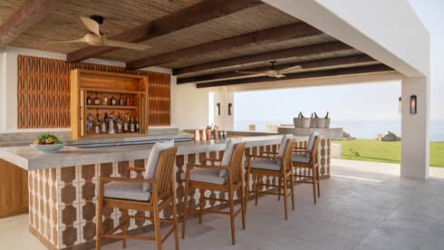 Outdoor, covered Brisol Pool Bar with ocean view at Four Seasons Cabo San Lucas at Cabo Del Sol
