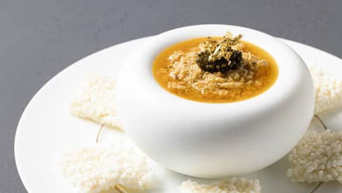Scorched Rice with Crab on a modern white plate