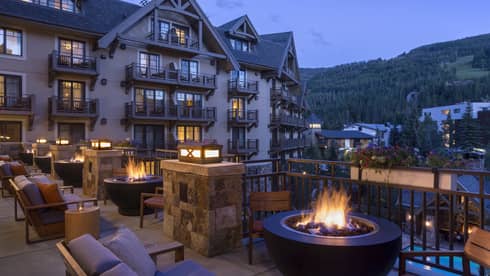 The Remedy Bar Terrace patio lounge, outdoor bonfire fireplace at night