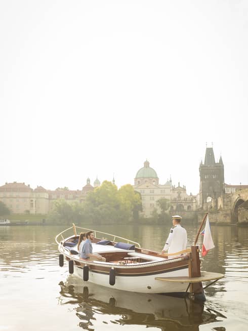 Couple enjoying river boat trip in Prague