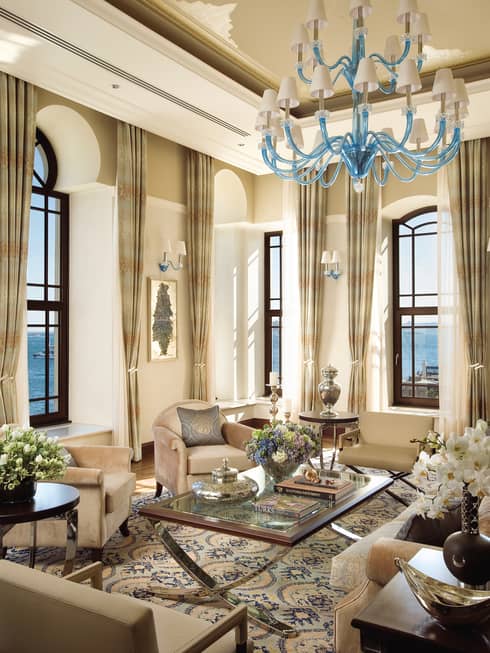 Elegant Ottoman-style seating lounge with chandelier, soaring ceilings