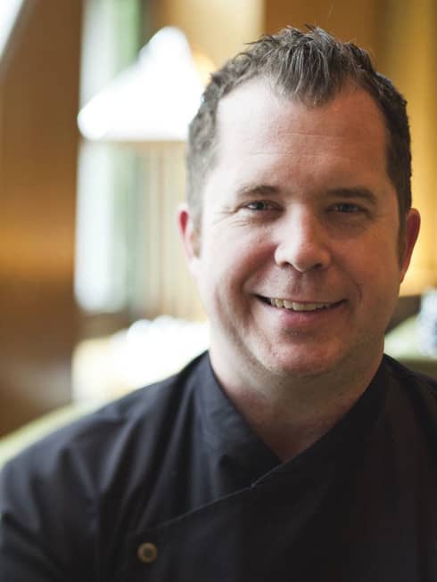 Portrait photo of Garden Restaurant Executive Chef John Johnson in uniform