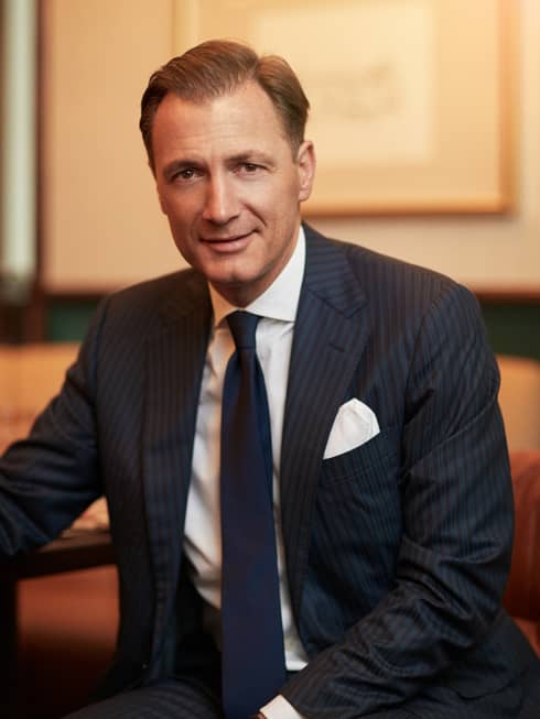 Portrait photo of Hotel Operations Asia Pacific President Rainer Stampfer wearing suit, tie