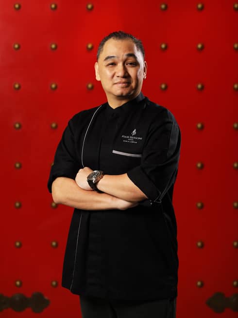 Portrait photo of Executive Chef, Yun House Jimmy Wong against red wall