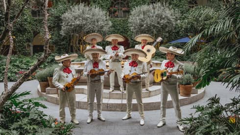 Mariachi band playing in a luxury hotel courtyard