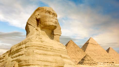 Famouse Sphinx and the great pyramids under interesting evening clouds, Cairo, Egypt