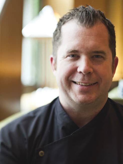 Portrait photo of Garden Restaurant Executive Chef John Johnson in uniform