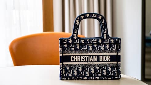 A bag with a Christian Dior label on it.