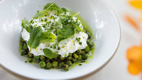 Delicate green dish plated in a white bowl