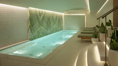 Spa pool area with lounge chairs