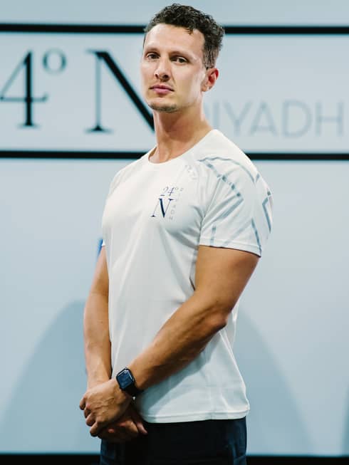 A front-facing shot of Mason Tustin in a white company shirt.