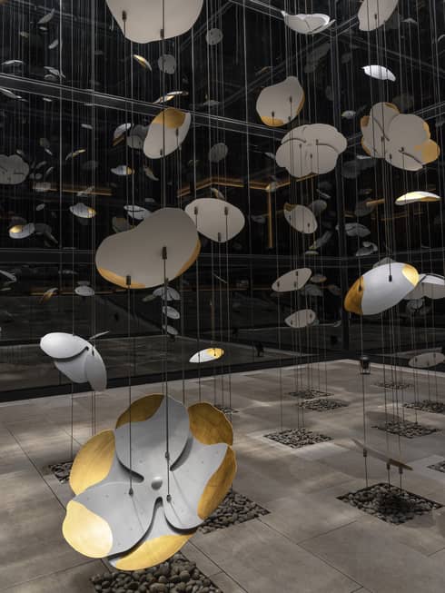 White and gold petals hang suspended in the center of the Hotel's inner courtyard