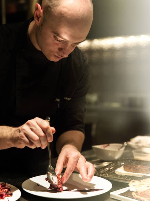 Chef Aniello Turco plating a dish