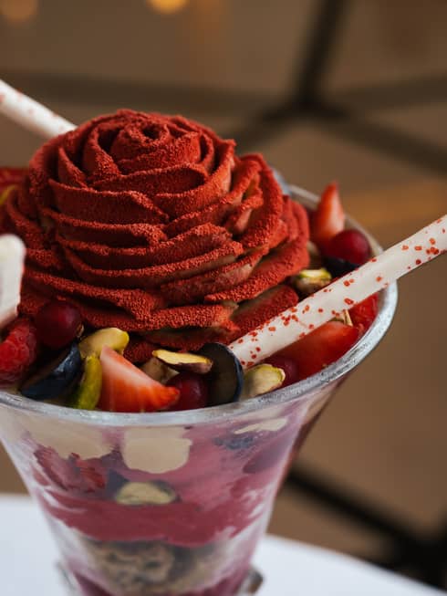 Red floral-shaped dessert in a conical glass