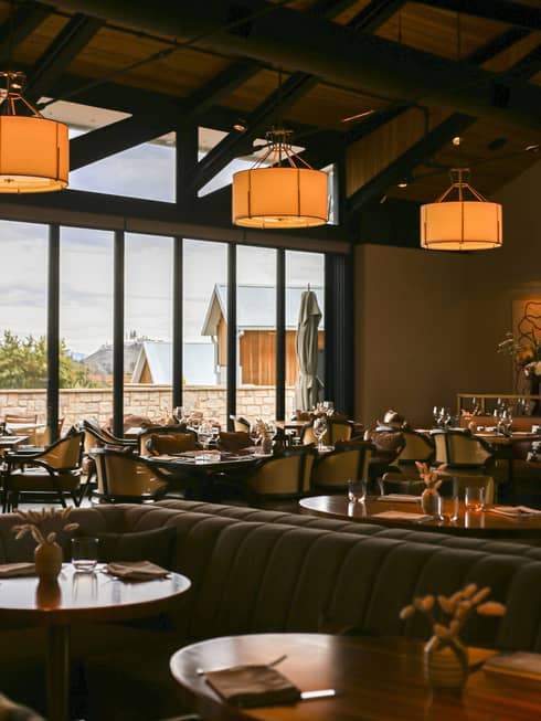 Dining room at TRUSS Restaurant + Bar with large, rectangular windows.