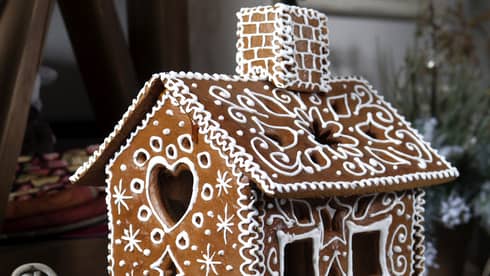 Gingerbread house decorated with white frosting