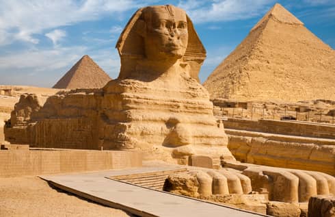 The Great Sphinx including the pyramids in the background