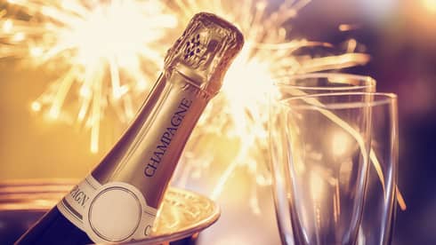 Fireworks, champagne and two champagne flutes