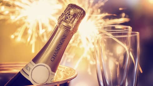 Fireworks, champagne and two champagne flutes