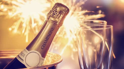 Fireworks, champagne and two champagne flutes