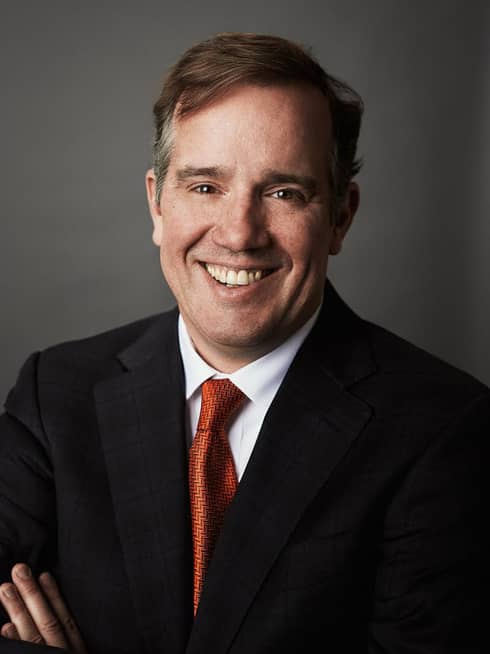 Portrait photo of Executive Vice President, Chief Marketing Officer Peter Nowlan wearing suit, tie