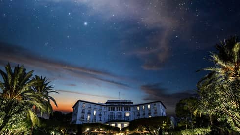 Starry sky, palm trees above Four Seasons Grand-Hotel du Cap-Ferrat