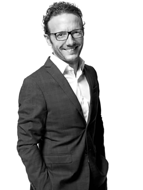 Black-and-white portrait photo of Chef Simone Zanoni